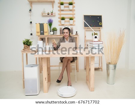Women using cellphone and wireless connection wi-fi technology in home.