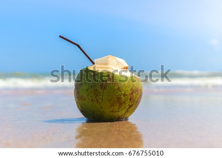 fresh coconut drink on the tropical beach 
