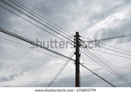 Electricity poles and power lines, sky background
