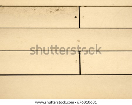 Clean yellow wooden wall background in close up view for adding text