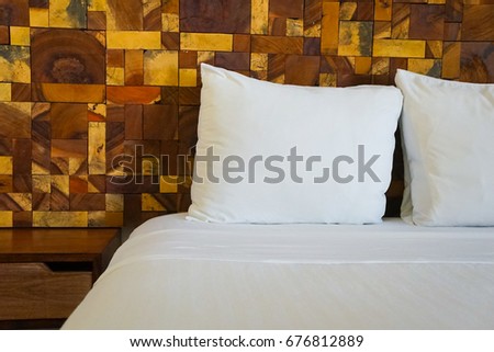 Modern Bed With Wooden Tiles and White Sheets 