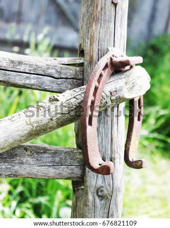 Horseshoe metal Vintage Weathered Wooden Background.Copy space. selective focus.