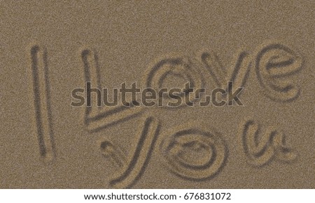Love text drawing on the sand at the beach