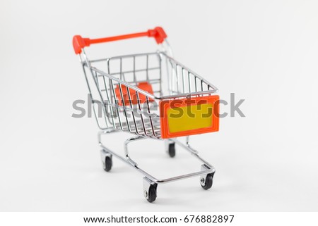 Mini Shopping Cart (Trolley) on White Background. Copy Space for Text.