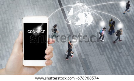 the concept art of world has social network connect with Man's hand shows mobile smartphone with black screen with background of people walk on open space concrete pavement from top view