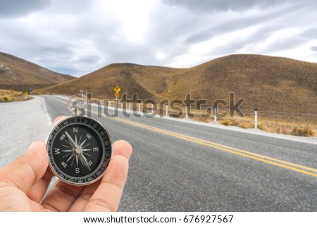 Compass with natural blur background. Travel concept