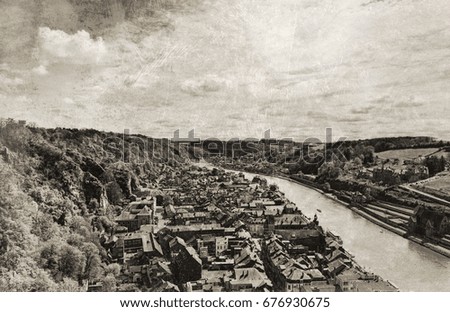 Embankment of the River Meuse in the Belgian City of Dinant. Beautiful small town Dinant in Belgium. Vintage style toned picture