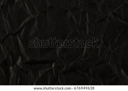 Blank crumpled black paper