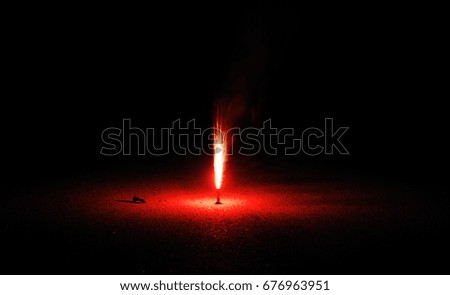fountain fireworks stream into dark night