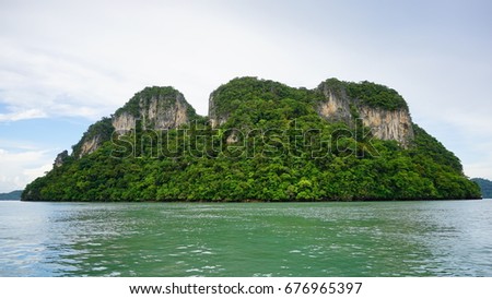 Langkawi is an island in Malaysia located in the north part with many small island around it 
