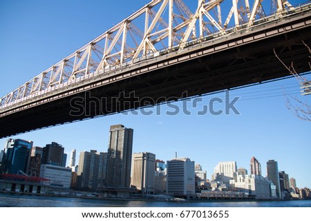 Queensboro bridge over East river and Manhattan with clearly blue sky