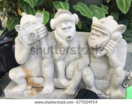 Three monkeys sculpture