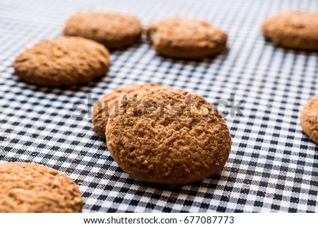 Anzac Biscuits on tablecloth.
