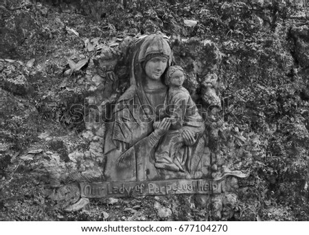 vintage sculptures of Mary and Christ