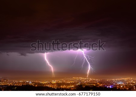 thunderbolt in the night sity Royalty-Free Stock Photo #677179150