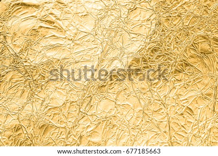 Gold wrinkled paper texture abstract background Royalty-Free Stock Photo #677185663