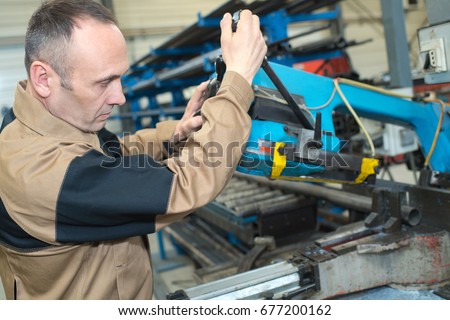 worker repairing a cutting knife
