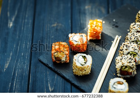 Japanese sushi on a rustic dark background