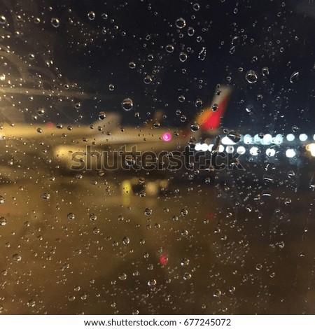 Rain drop with blurred airplane background at runway, Bangkok Thailand