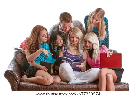 The group of young people sits on a sofa  with books and laptop  on a white background.