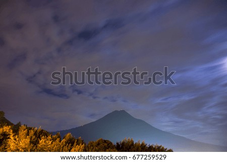 Night view of volcano Agua in Guatemala from La Antigua Guatemala.