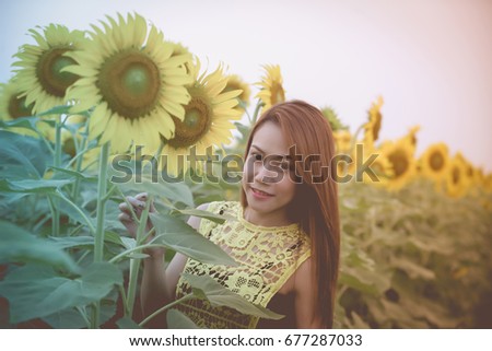 Asian girl in the sunflower field