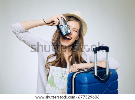 Happy woman traveler take pictures with camera. isolated concept portrait.