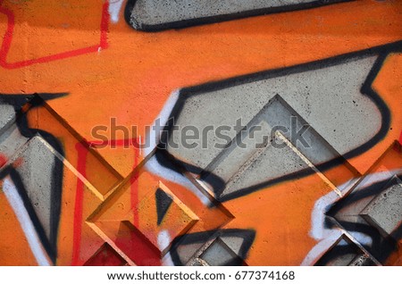 Texture of a fragment of the wall with graffiti painting, which is depicted on it. An image of a piece of graffiti drawing as a photo on street art and graffiti culture topics