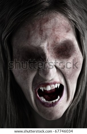 Portrait of an eyeless female ghoul or zombie Royalty-Free Stock Photo #67746034