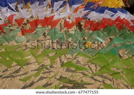 flag on a heap of sand in Songkran festival at Thailand