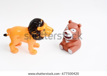 animal toys lion and bear on white background 