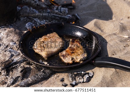 Good natural tasty two slices of meat steak fried on pan