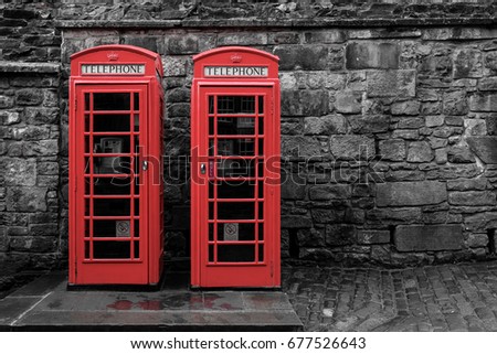 red phone booths on the street in the UK