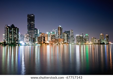 shimmering skyline of miami along biscayne bay on cloudless night, december 2010