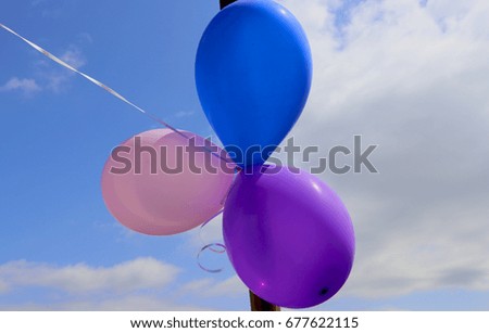 Balloons against the blue sky. Helium balloons against a bright blue sky.