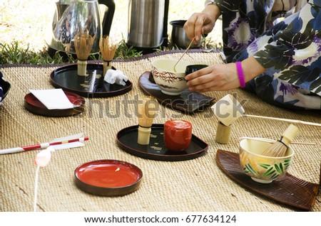 Japanese women making sado chanoyu or Japanese tea ceremony, also called the Way of tea at outdoor in Nakhon Ratchasima, Thailand Royalty-Free Stock Photo #677634124