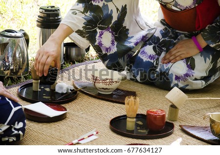 Japanese women making sado chanoyu or Japanese tea ceremony, also called the Way of tea at outdoor on January 29, 2017 in Nakhon Ratchasima, Thailand Royalty-Free Stock Photo #677634127
