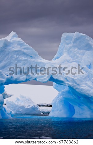 Large Arctic iceberg with a cavity inside
