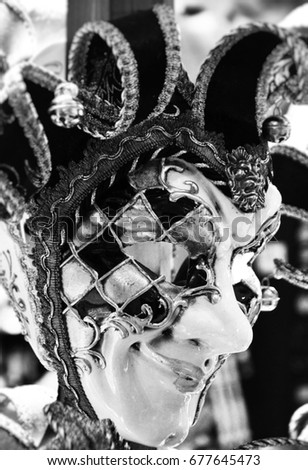 designed venetian mask close up - on the historical streets of Venice  