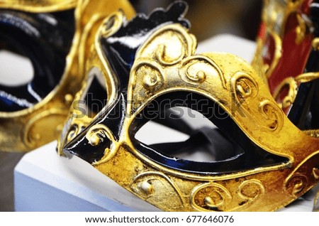 designed venetian mask close up - on the historical streets of Venice   