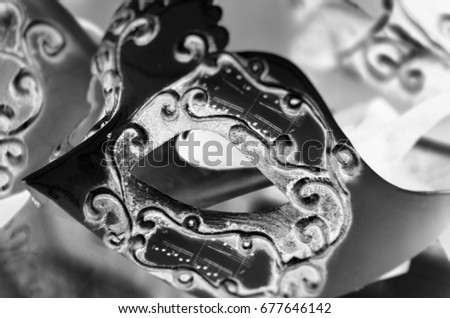 designed venetian mask close up - on the historical streets of Venice   