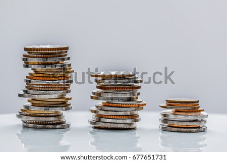 coins on the wood black background and saving baked clay