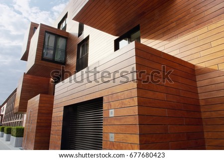  Modern contemporary wood sided building Royalty-Free Stock Photo #677680423