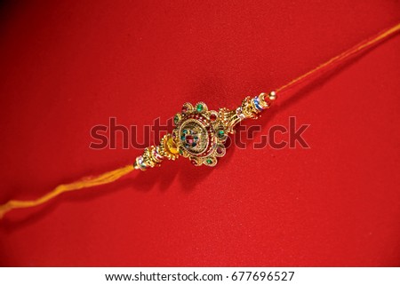 Indian festival Raksha Bandhan , Raakhi on red background