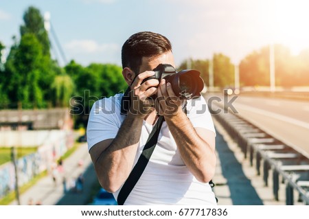 Photographer is taking photo on the road.