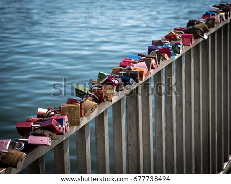 Romantic Lover Padlocks on a Bridge in row
