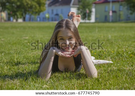 Girl sunbathing on the grass