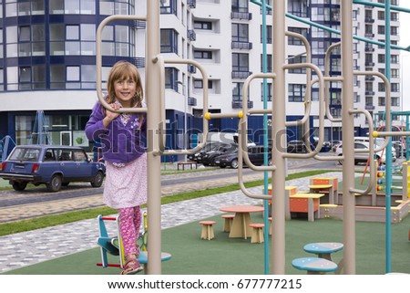 cute smiling girl on a playground