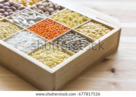 Various legumes in wooden box