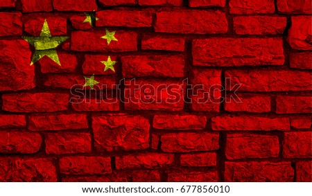 on a photo the flag of China against the background of a brick wall is represented